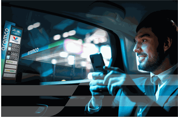 Man holding smartphone in car at night
