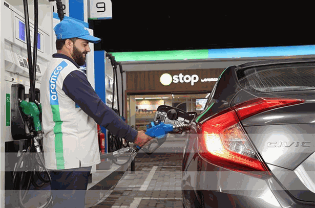 Service attendant refueling a car